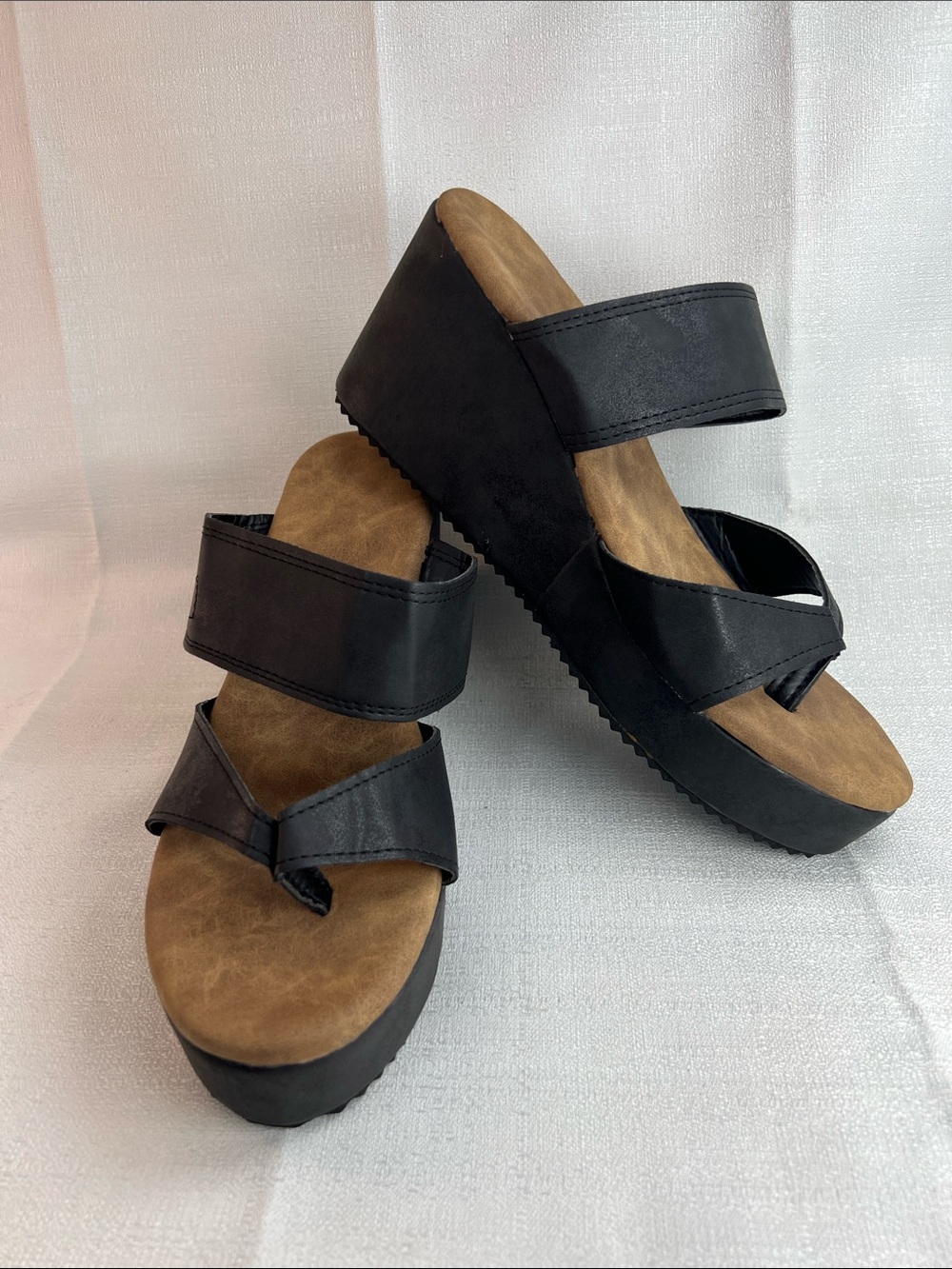Black straps with brown insole wedges